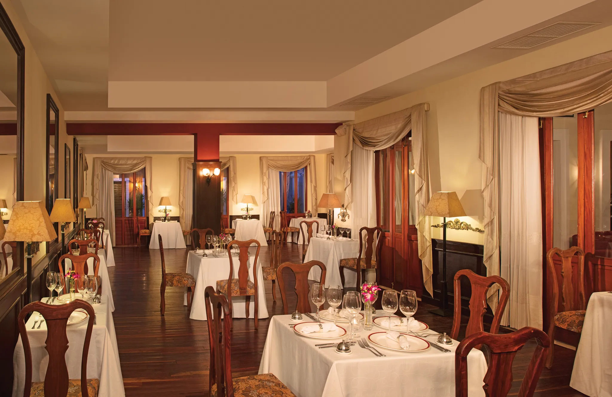 Bordeaux restaurant at Dreams Tulum Resort & Spa featuring an elegant adults-only dining atmosphere with refined French cuisine and sophisticated décor.