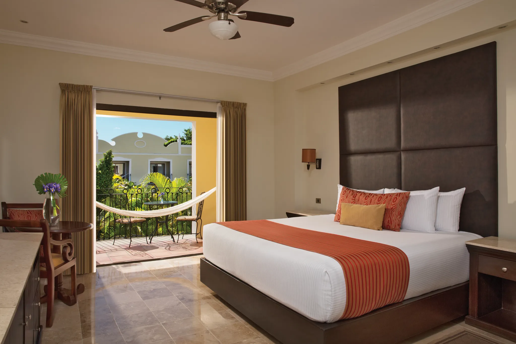 Deluxe Garden View Adults-Only room with king bed, hammock balcony, and tropical garden views at Dreams Tulum Resort & Spa.