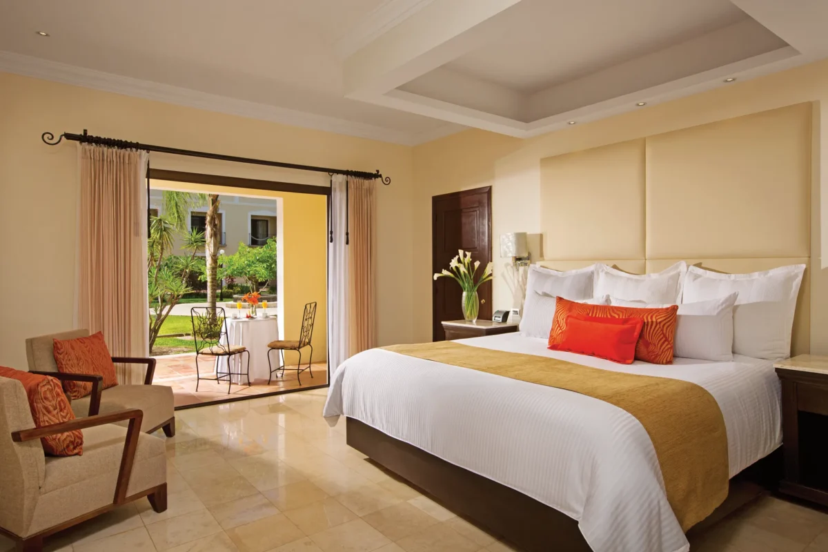 Deluxe Garden View king room with furnished terrace and tropical garden views at Dreams Tulum Resort & Spa.