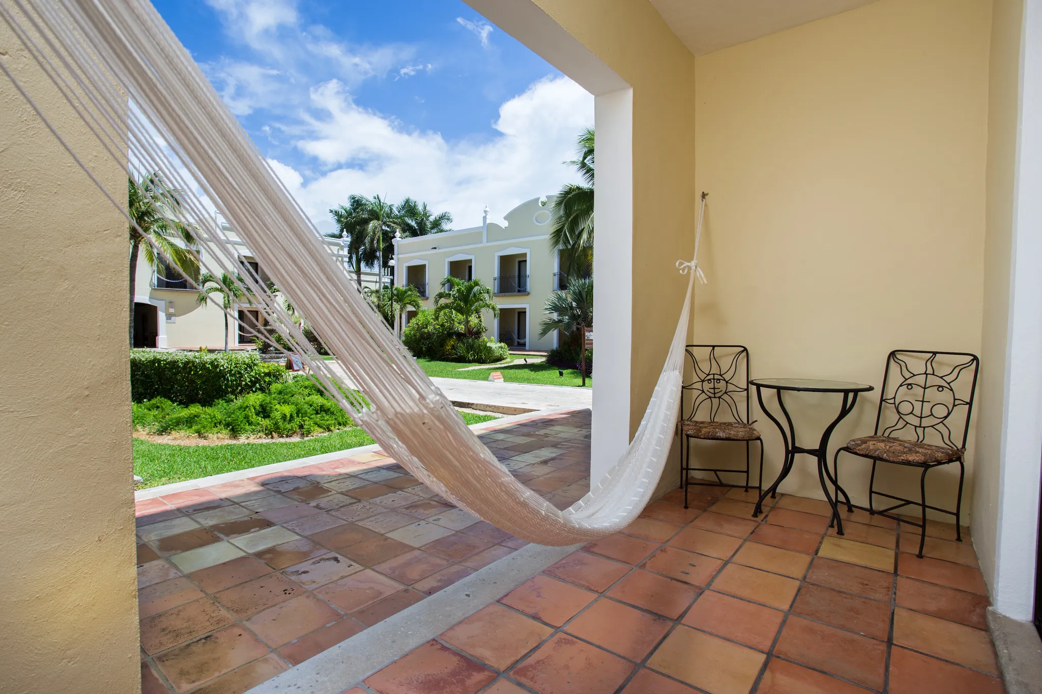 Private terrace with hammock and garden views at Deluxe Garden View room in Dreams Tulum Resort & Spa.