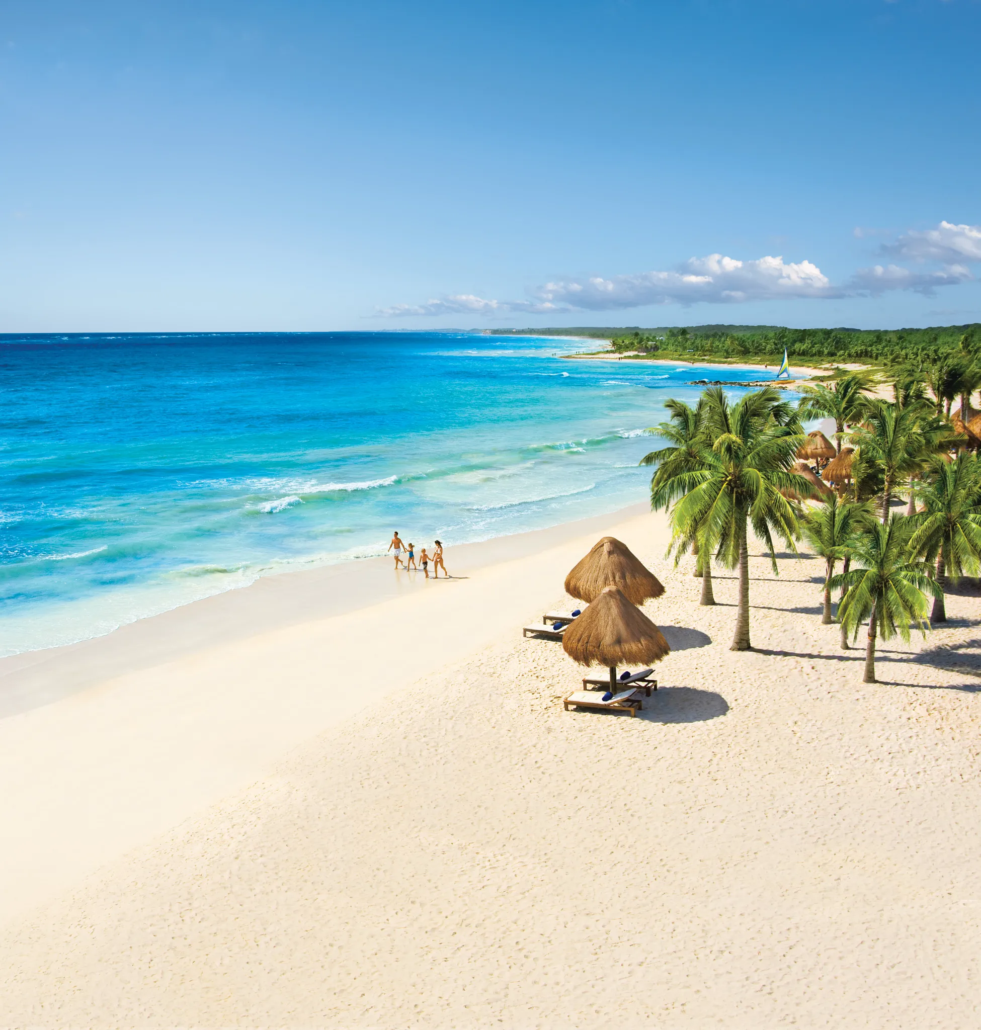 White-sand beach and turquoise Caribbean waters at Dreams Tulum Resort & Spa in Riviera Maya.
