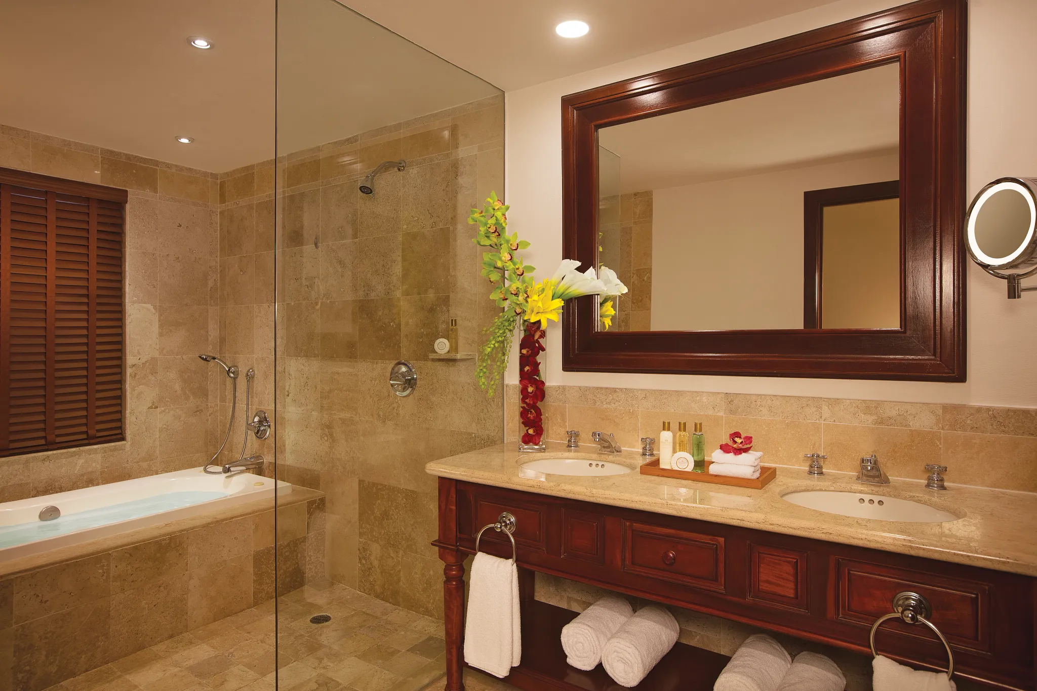 Junior Suite Garden View marble bathroom with hot tub and double sinks at Dreams Tulum Resort & Spa.