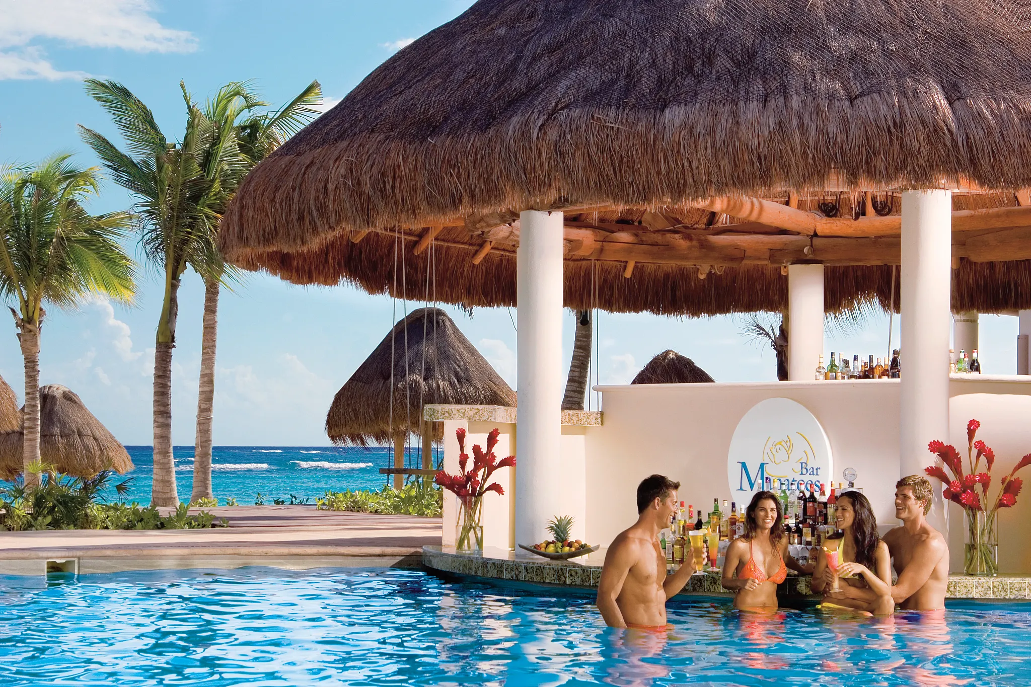 Manatees restaurant at Dreams Tulum Resort & Spa featuring open-air beachfront dining, tropical surroundings, and stunning Caribbean Sea views.