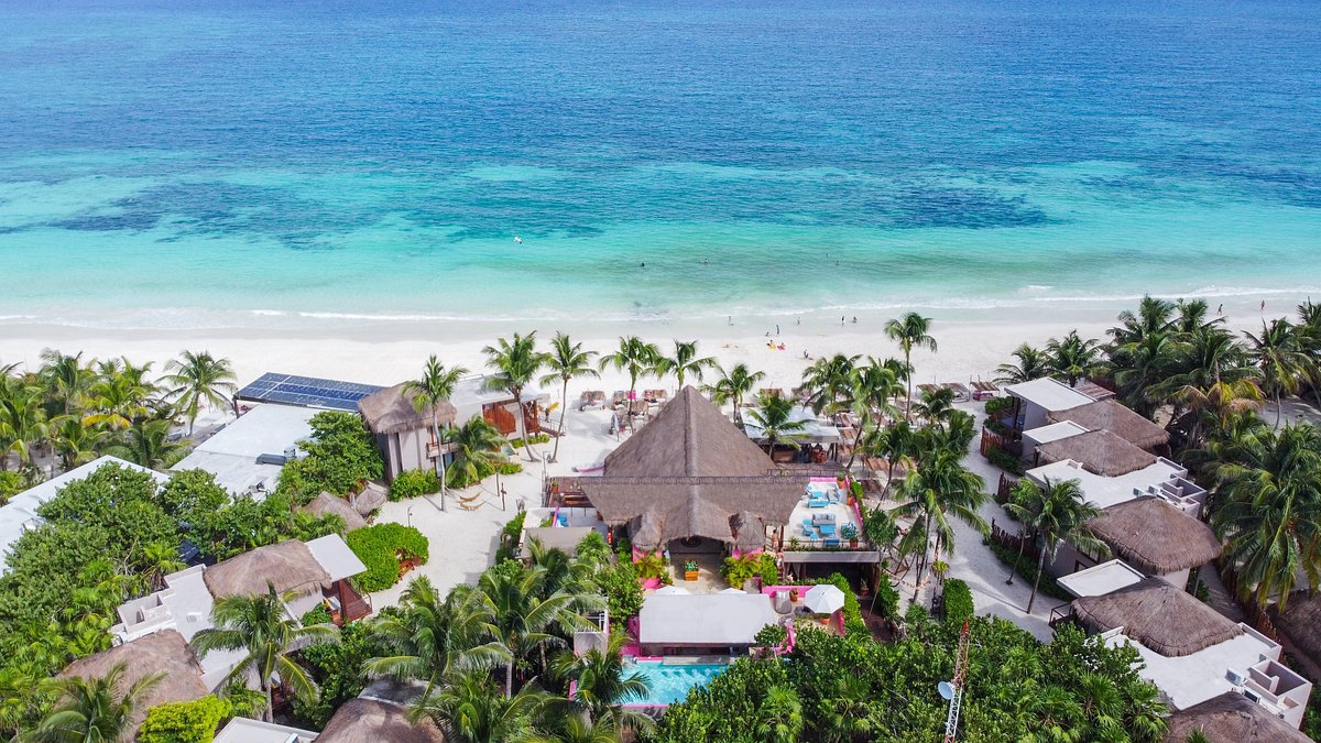 Nomade Tulum luxury beachfront resort with bohemian design, wellness experiences, and Caribbean coastline views in Tulum, Mexico.