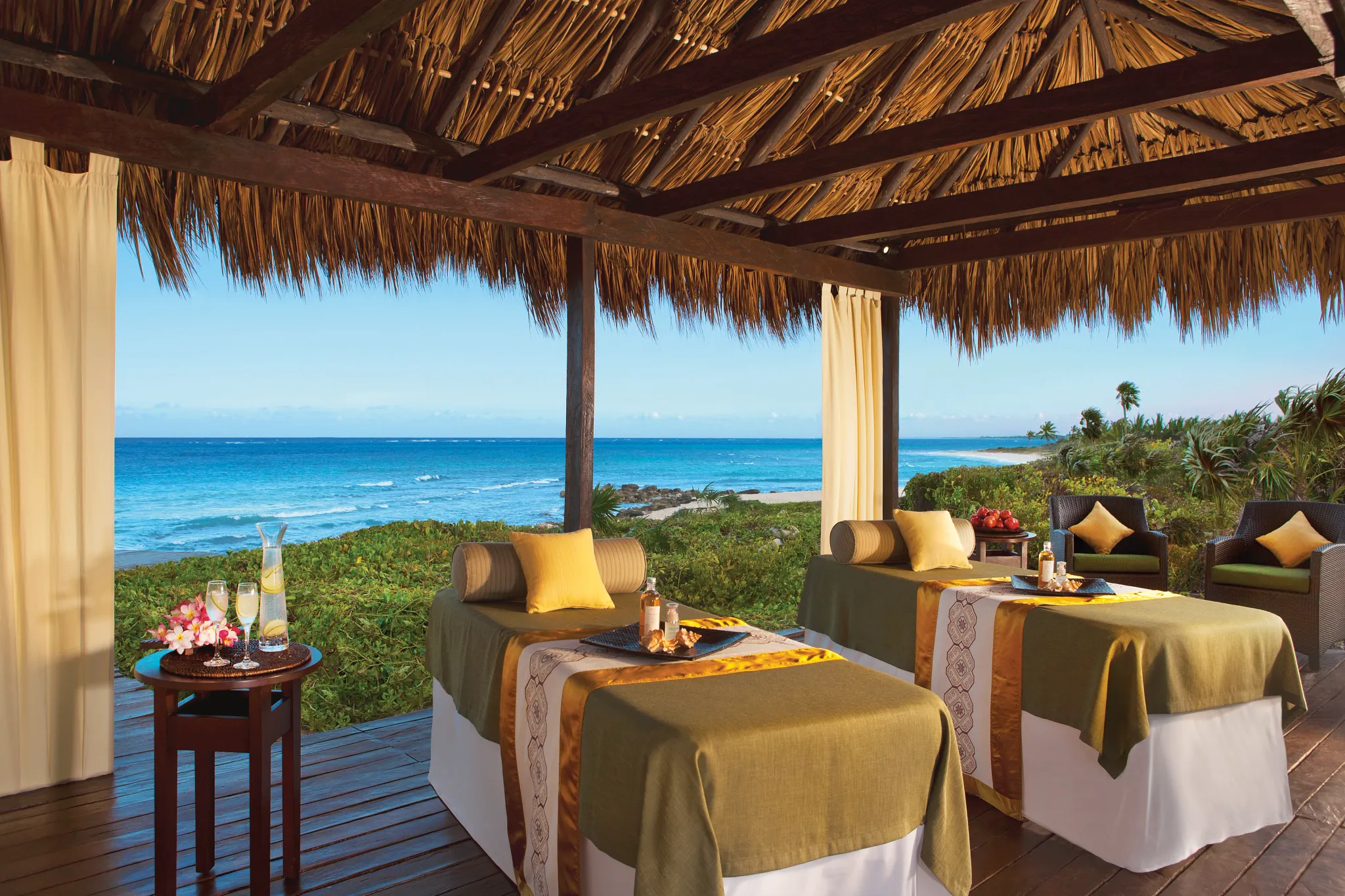 Oceanfront spa treatment cabanas with stunning Caribbean Sea views at Dreams Tulum Resort & Spa.