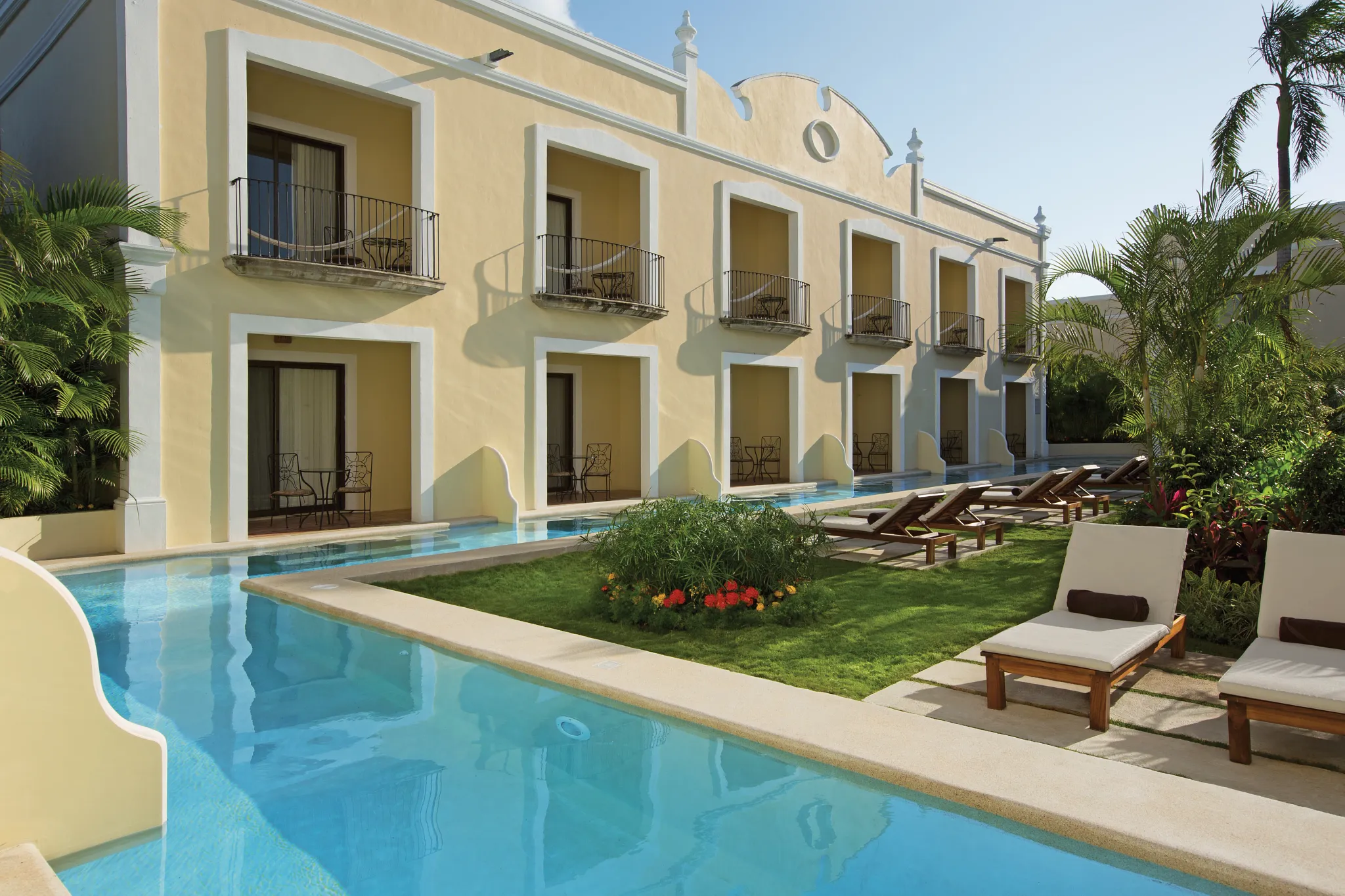 Preferred Club Deluxe Garden Swim Out suites with direct pool access at Dreams Tulum Resort & Spa.