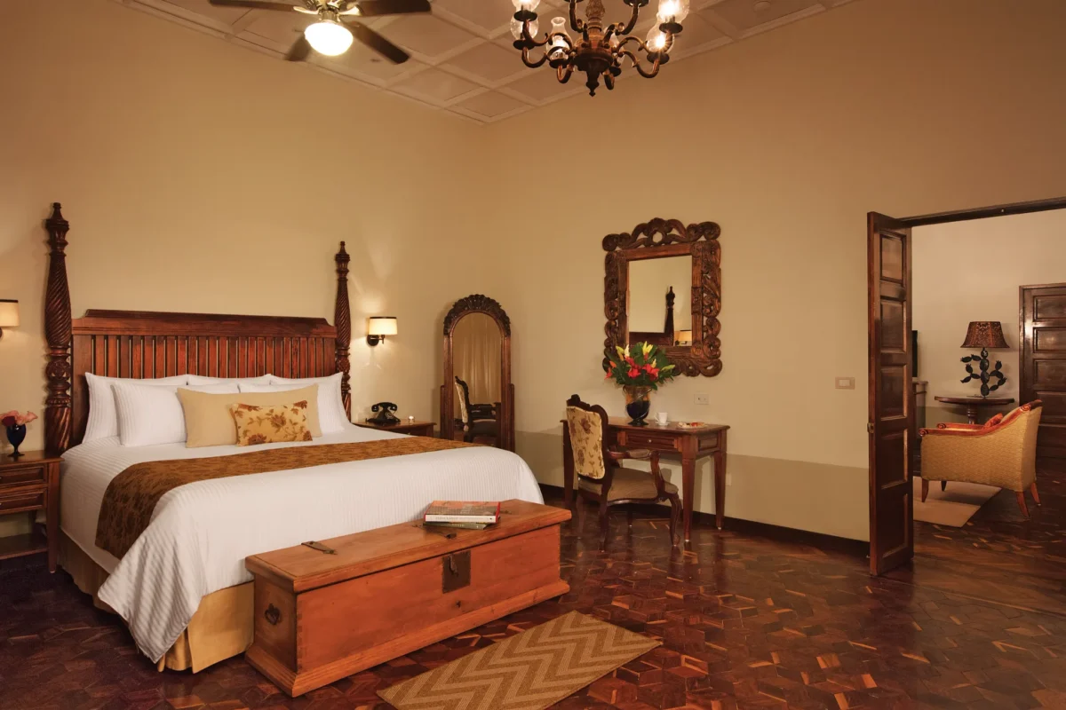 Preferred Club Hacienda Presidential Suite bedroom with king bed and elegant Mexican décor at Dreams Tulum Resort & Spa.