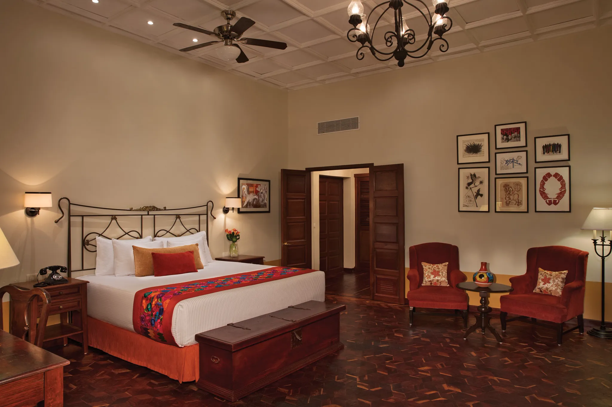 Preferred Club Hacienda Suite with king-size bed, elegant Mexican décor, sitting area, and high coffered ceilings at Dreams Tulum Resort & Spa.