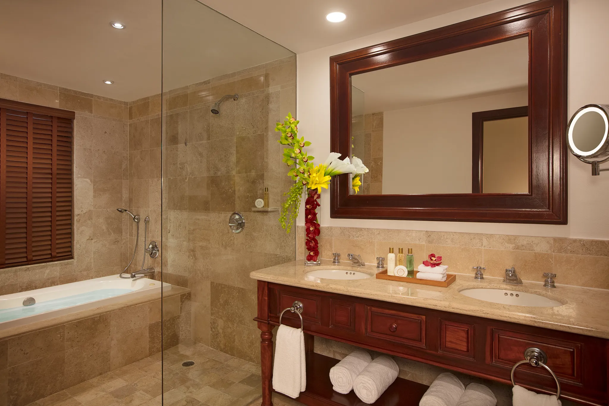 Preferred Club Junior Suite Garden View marble bathroom with double vanity and hot tub at Dreams Tulum Resort & Spa.