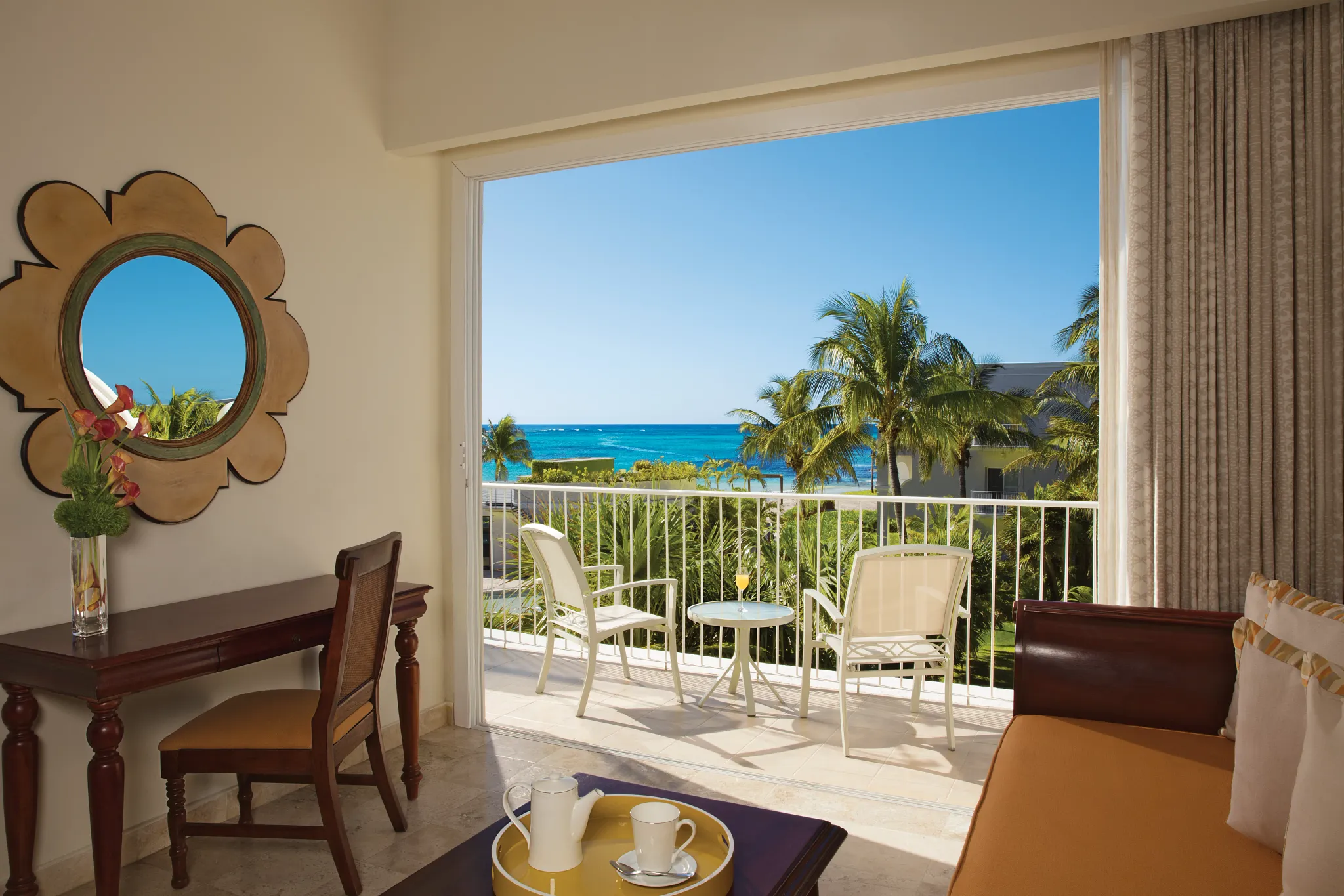 Private balcony with ocean view at Preferred Club Junior Suite Ocean View in Dreams Tulum Resort & Spa.