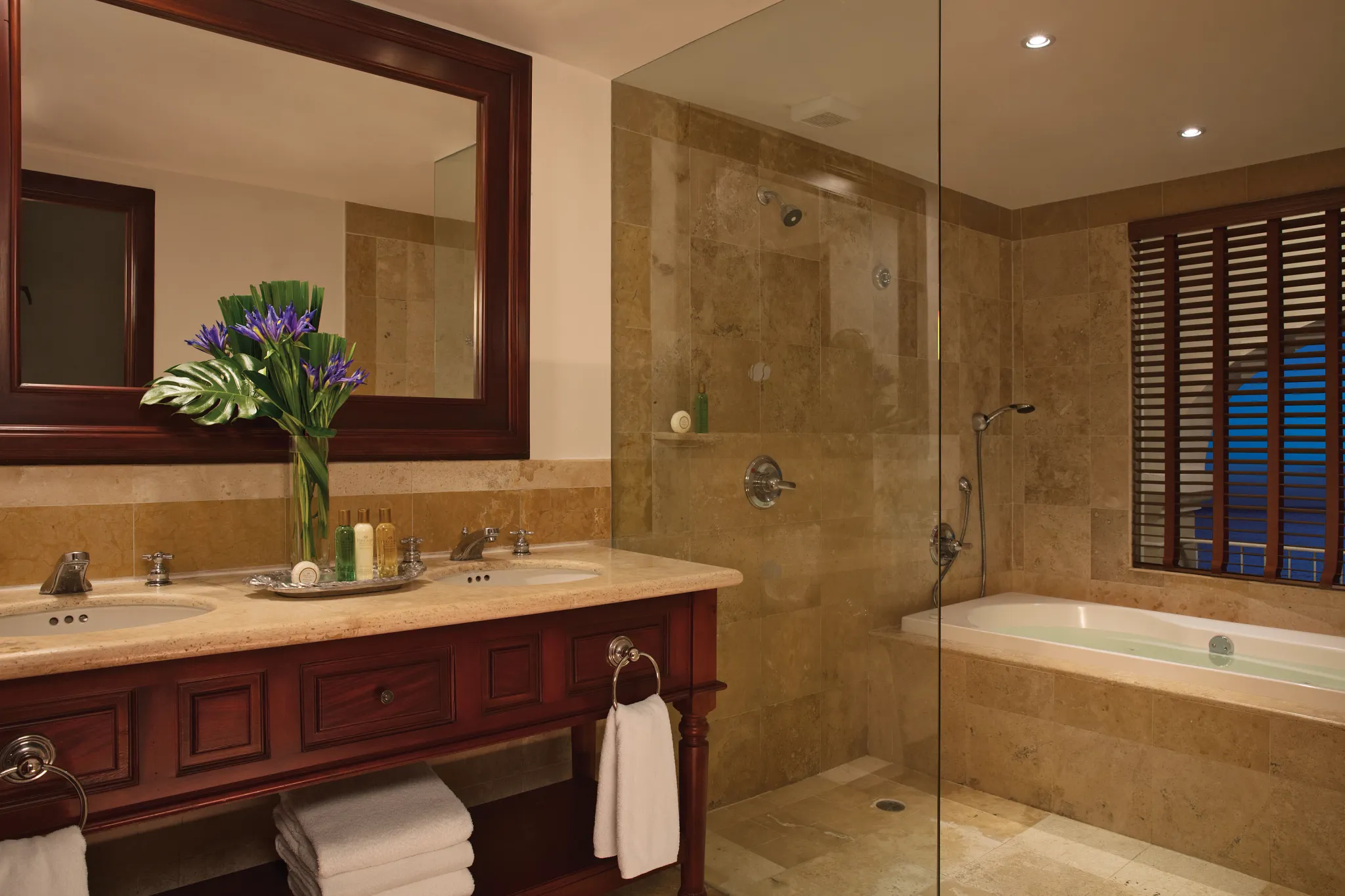Preferred Club Junior Suite Ocean View with two double beds and tropical décor at Dreams Tulum Resort & Spa.