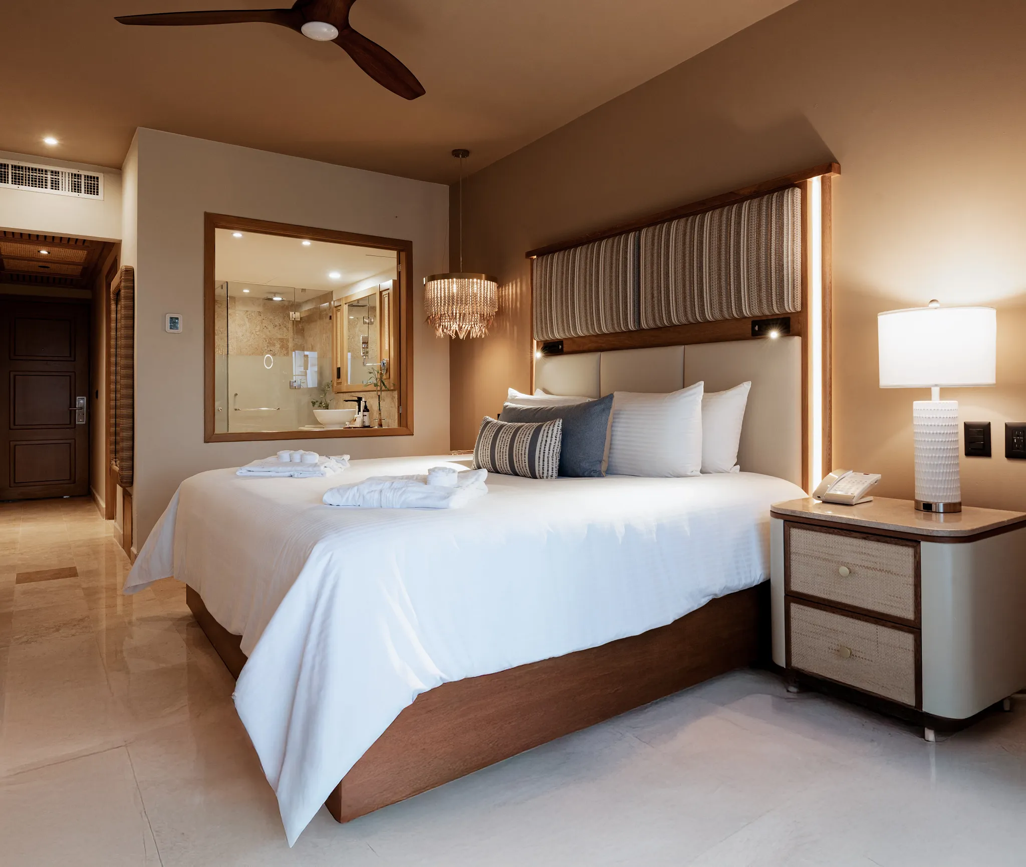 Preferred Club Ocean View bedroom with king bed and luxury lighting at Dreams Tulum Resort & Spa.
