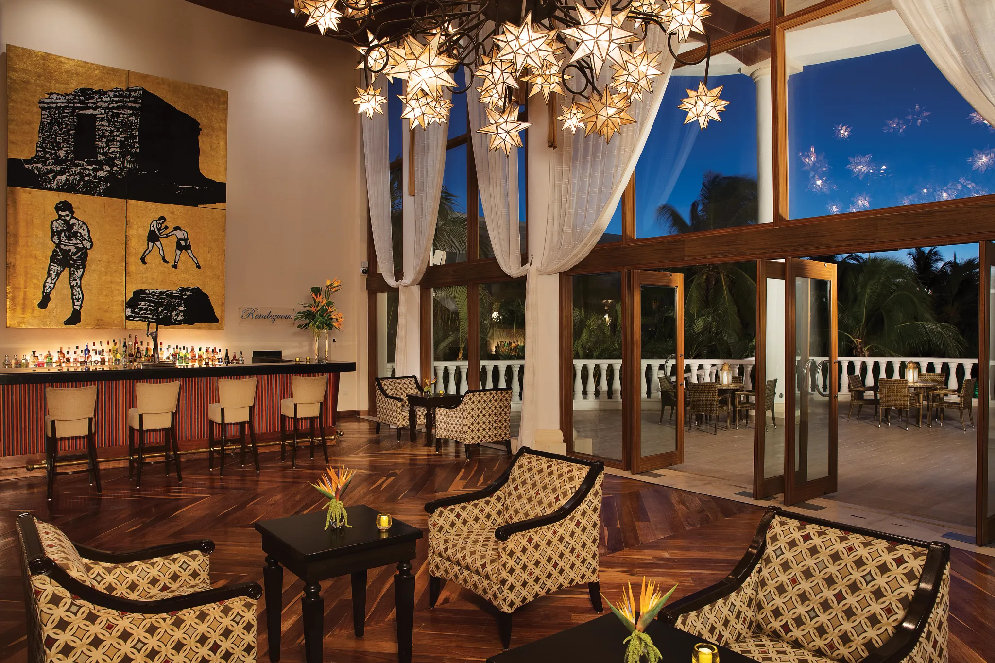 Rendezvous lobby bar at Dreams Tulum Resort & Spa featuring elegant lounge seating, handcrafted cocktails, and a sophisticated social atmosphere.