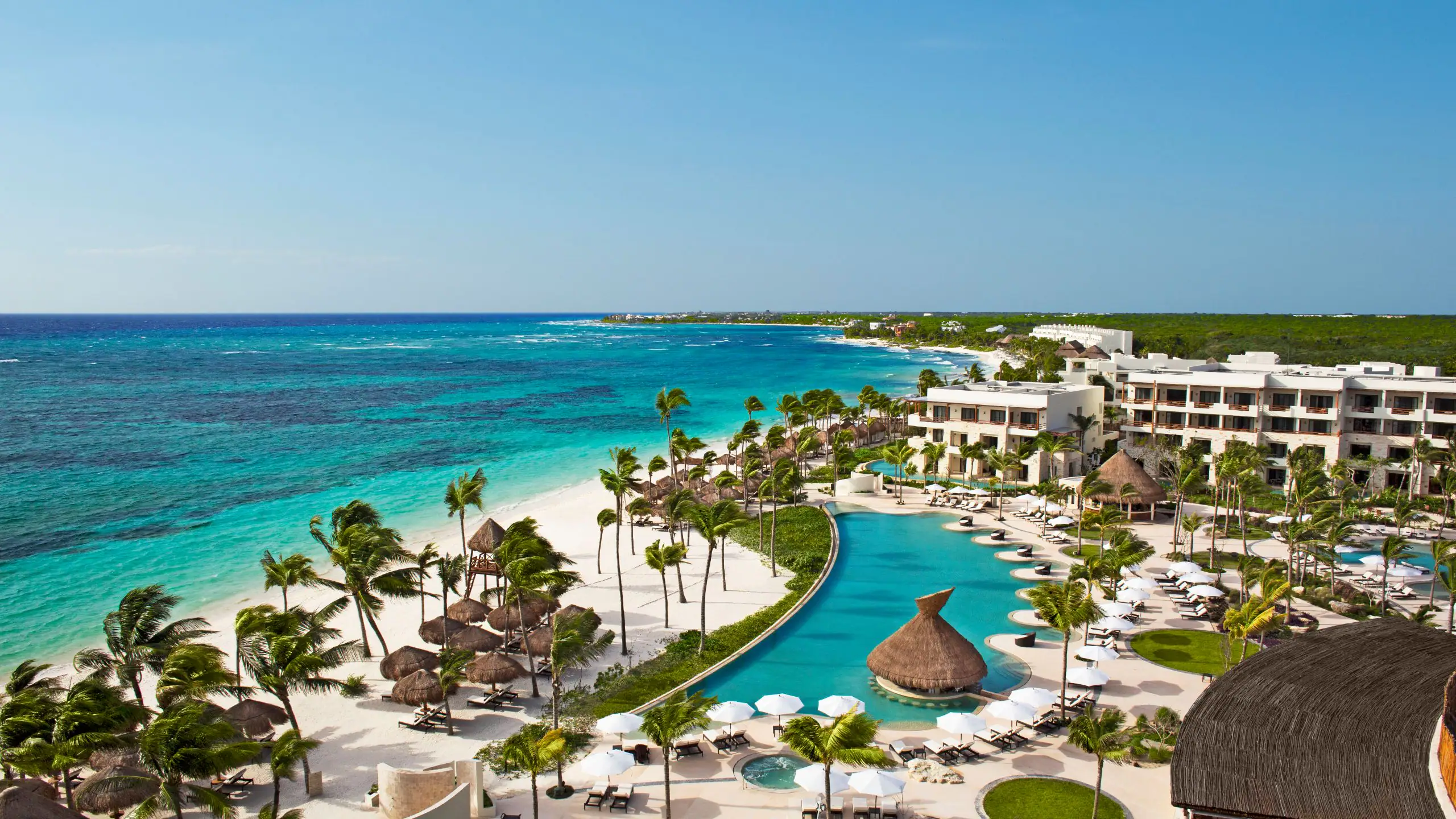 Secrets Akumal Riviera Maya adults-only luxury all-inclusive resort with beachfront pools and Caribbean Sea views.
