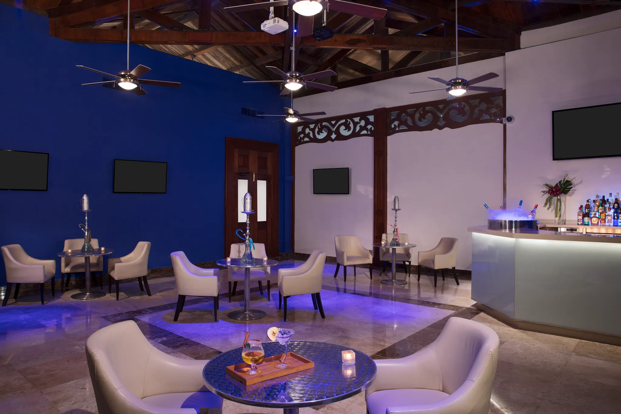 Sky Bar at Dreams Tulum Resort & Spa featuring an elevated open-air lounge, handcrafted cocktails, and panoramic views of the resort and Caribbean coastline.