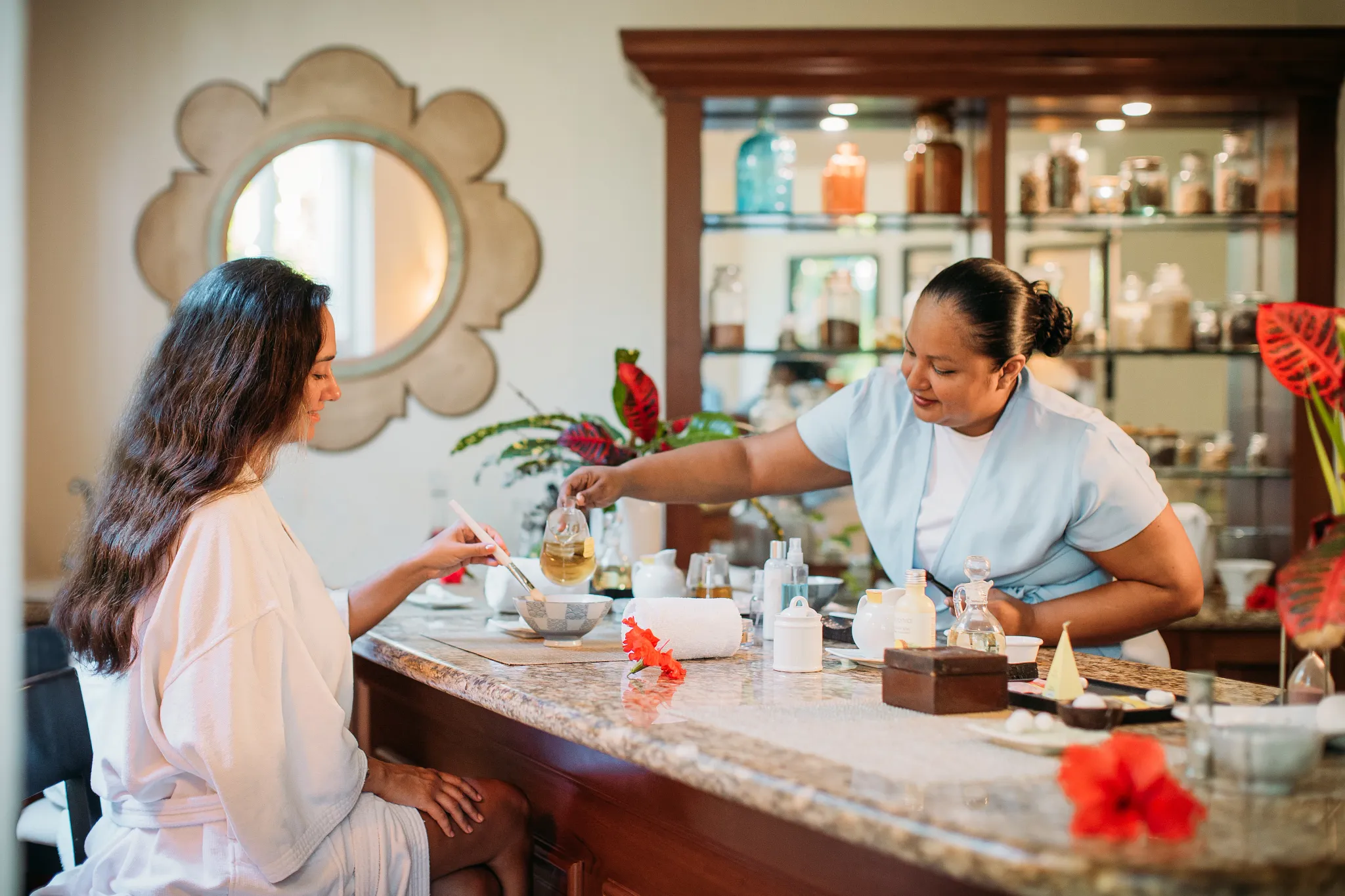 Guest receiving a personalized spa consultation at Dreams Spa by Pevonia at Dreams Tulum Resort & Spa.