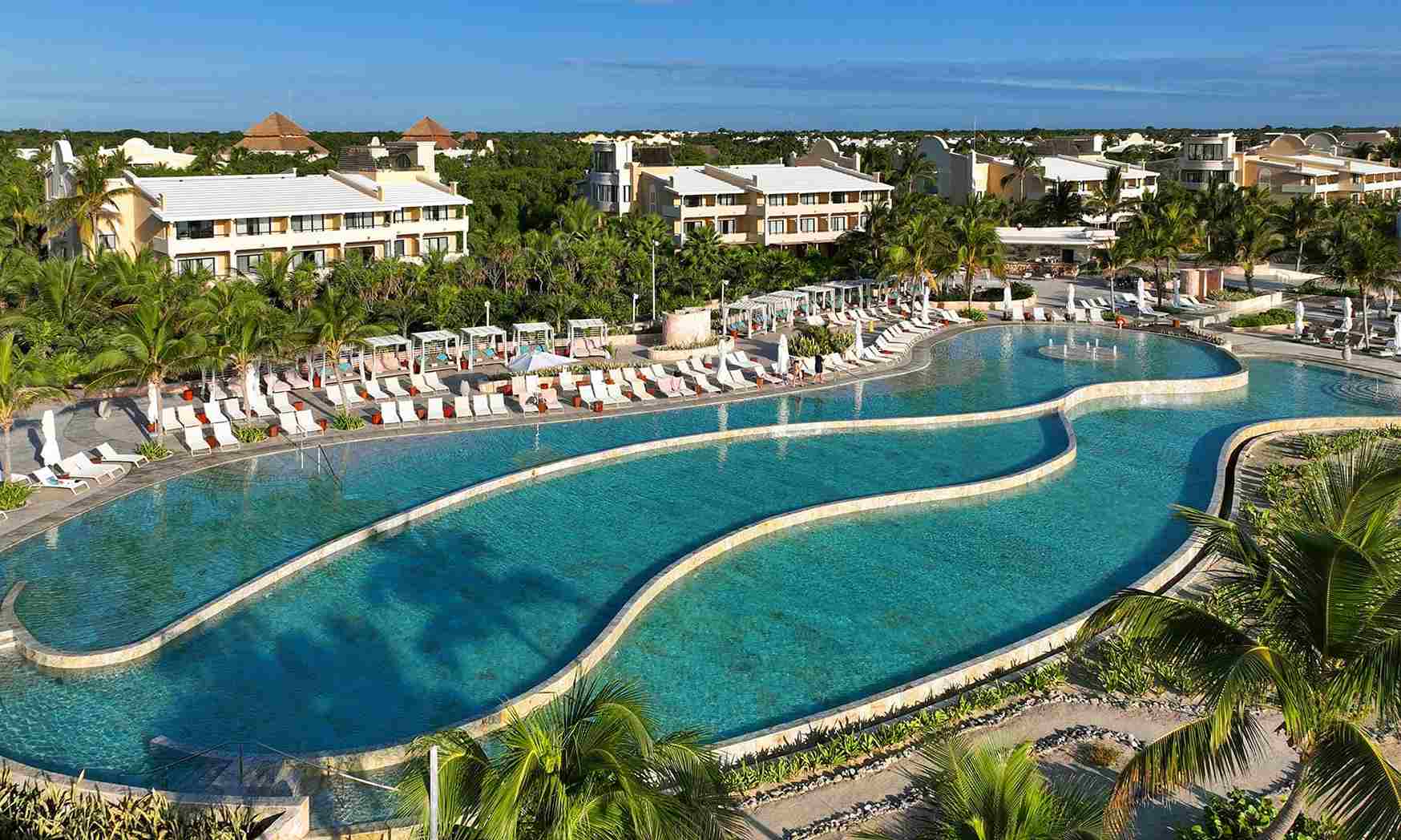 TRS Yucatan Hotel adults-only luxury all-inclusive resort with upscale pools and modern accommodations in Riviera Maya.