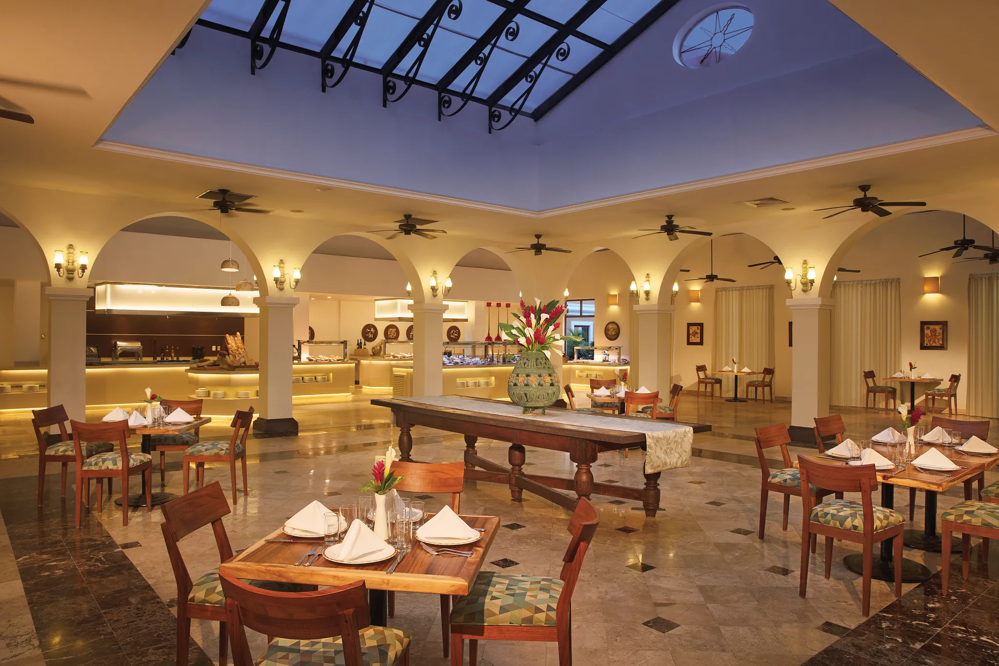 World Café at Dreams Tulum Resort & Spa featuring an international buffet, vibrant dining stations, and a welcoming family-friendly atmosphere.